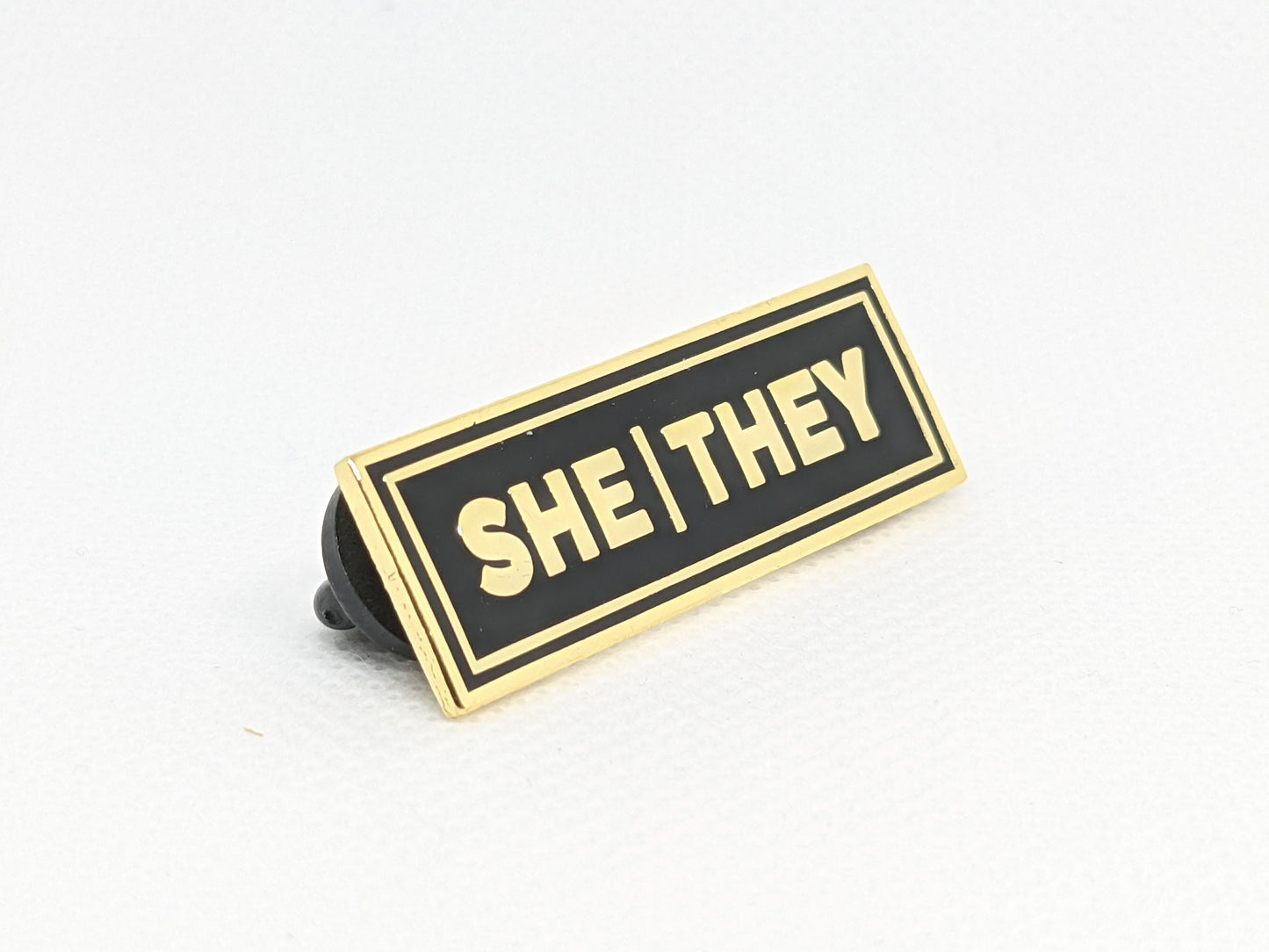 She/They Rectangle Pronoun Pin Silver or Gold Hard Enamel 1.5 by .5 in | Femme Nonbinary Pronoun Badge