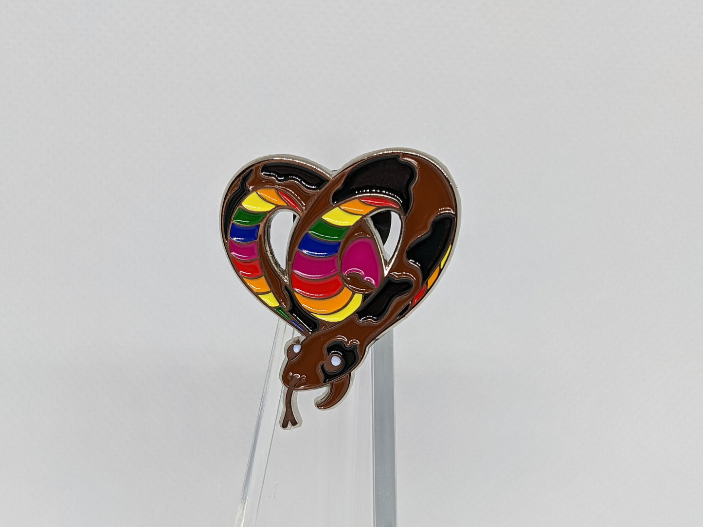 Subtle Pride LGBTQ Rainbow Pride Flag Heart-Shaped Snake Enamel Pin | Brown body, Black Spots, Rainbow Striped Stomach