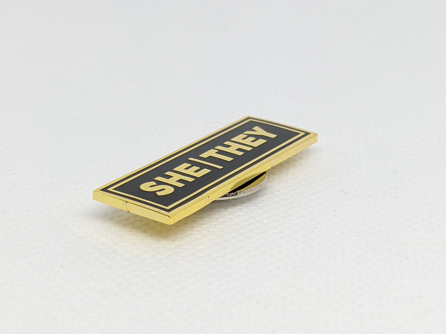 She/They Rectangle Pronoun Pin Silver or Gold Hard Enamel 1.5 by .5 in | Femme Nonbinary Pronoun Badge