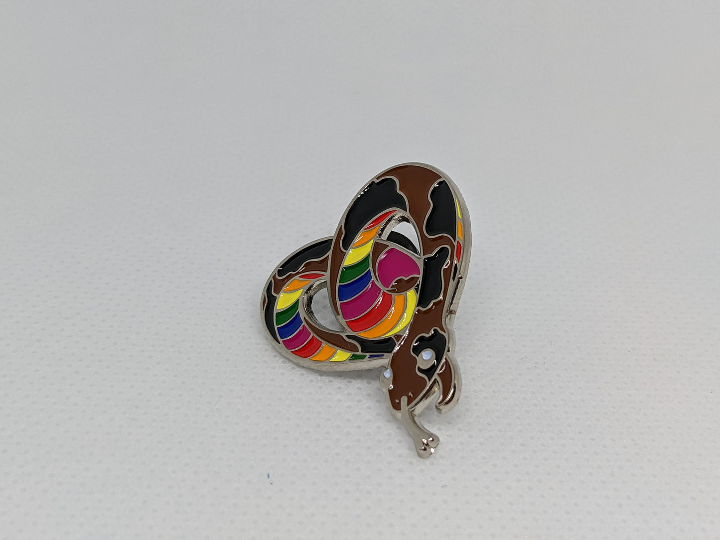 Subtle Pride LGBTQ Rainbow Pride Flag Heart-Shaped Snake Enamel Pin | Brown body, Black Spots, Rainbow Striped Stomach