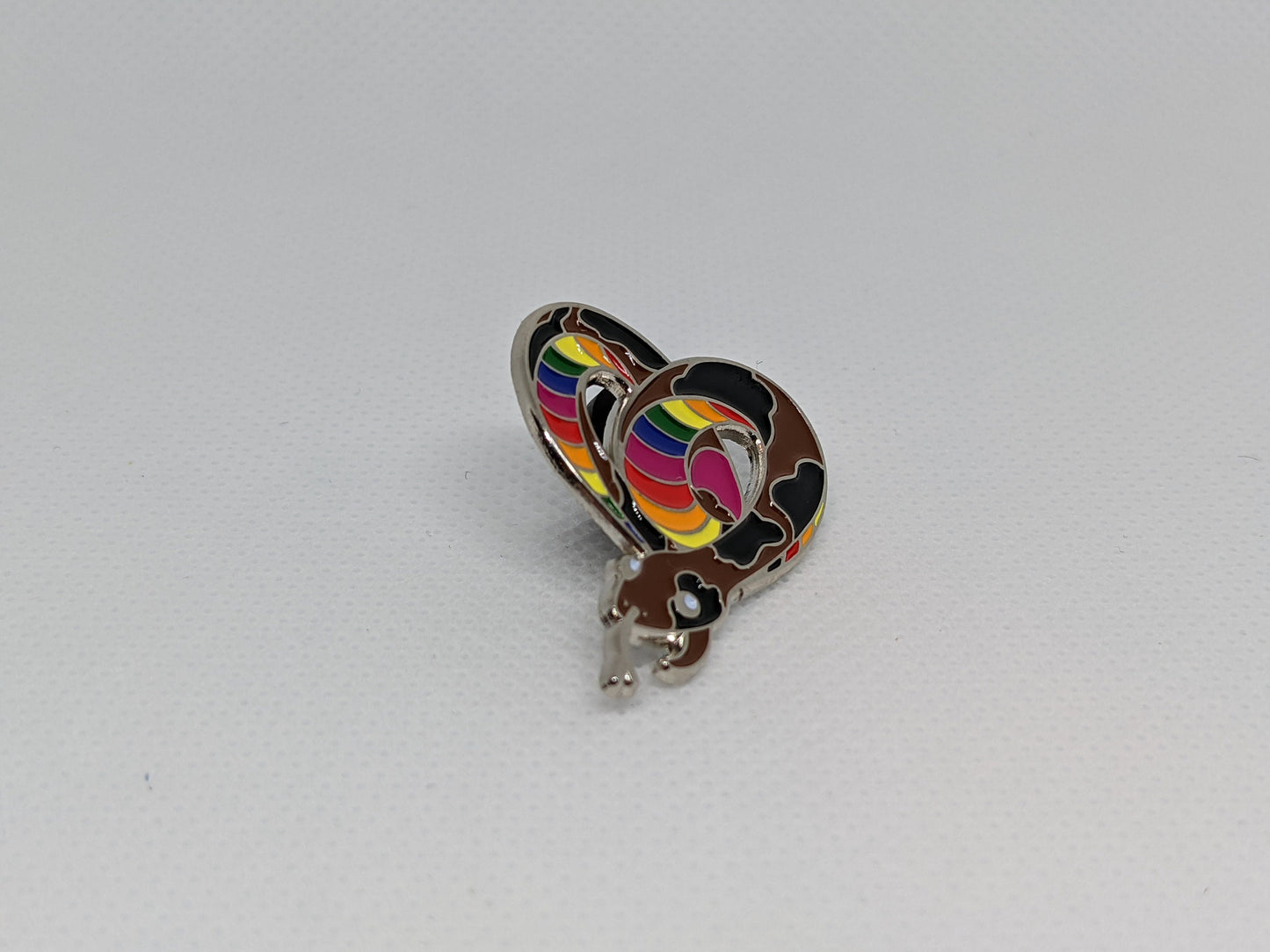 Subtle Pride LGBTQ Rainbow Pride Flag Heart-Shaped Snake Enamel Pin | Brown body, Black Spots, Rainbow Striped Stomach