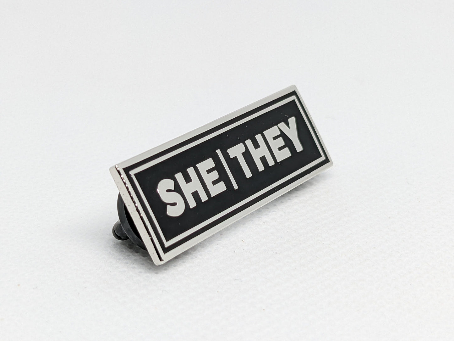 She/They Rectangle Pronoun Pin Silver or Gold Hard Enamel 1.5 by .5 in | Femme Nonbinary Pronoun Badge