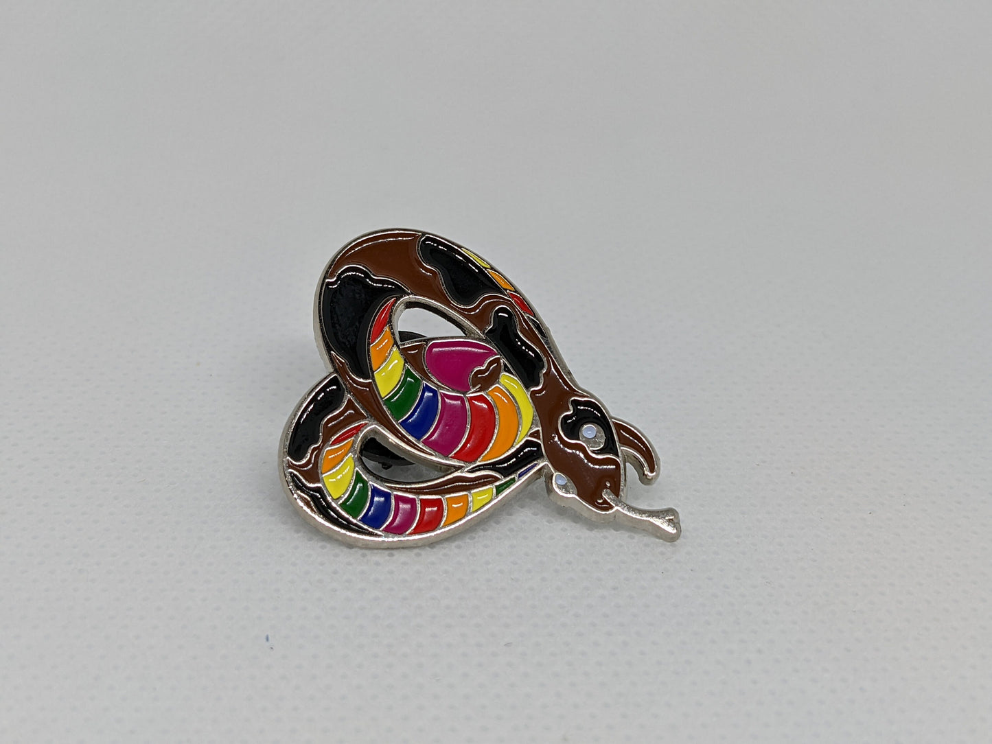 Subtle Pride LGBTQ Rainbow Pride Flag Heart-Shaped Snake Enamel Pin | Brown body, Black Spots, Rainbow Striped Stomach
