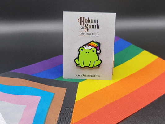 Subtle Gay Frog Pin | Chibi Frog Wearing Rainbow Gay Pride Flag Beanie or Santa Hat for Gay Christmas or Every Day